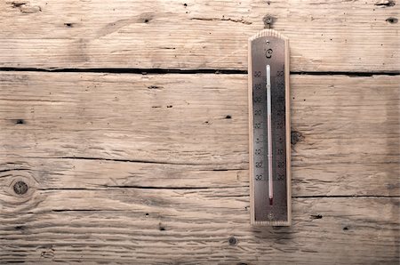 Old thermometer on a wooden background Fotografie stock - Microstock e Abbonamento, Codice: 400-06420825