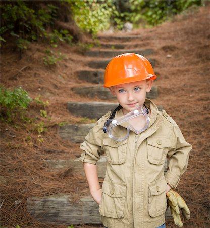 simsearch:400-06461025,k - Happy Adorable Child Boy with Big Gloves, Hard Hat and Goggles Playing Handyman Outside. Foto de stock - Super Valor sin royalties y Suscripción, Código: 400-06420867