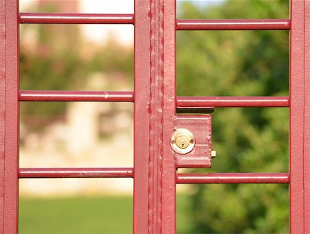 red gate into yard with the lock Stock Photo - Budget Royalty-Free & Subscription, Code: 400-06422157