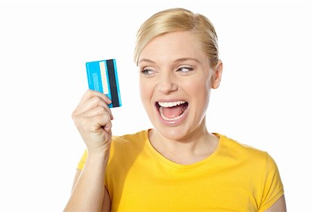 Excited young girl holding debit-card isolated over white background Stock Photo - Budget Royalty-Free & Subscription, Code: 400-06422762