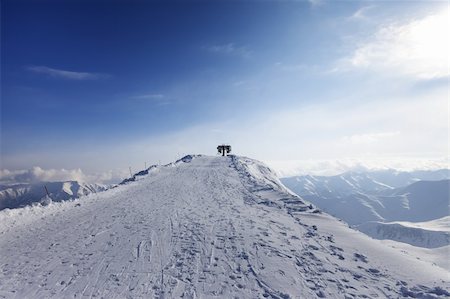 sky view mountain road winter - Top station of ropeway. Caucasus Mountains, Georgia, ski resort Gudauri, Mt. Sadzele. Stock Photo - Budget Royalty-Free & Subscription, Code: 400-06423345