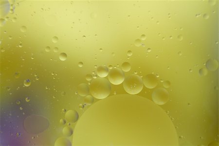 Oil droplets floating on water Stock Photo - Budget Royalty-Free & Subscription, Code: 400-06423944