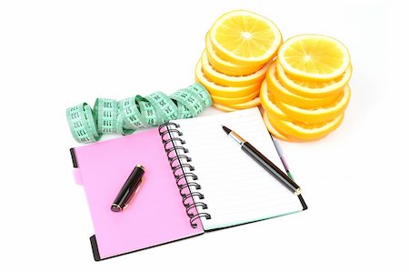 slices of orange, notebook, pen, and meter isolated with soft shadow and reflection over white background Foto de stock - Super Valor sin royalties y Suscripción, Código: 400-06423973