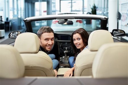 Young couple in a convertible Stock Photo - Budget Royalty-Free & Subscription, Code: 400-06456406