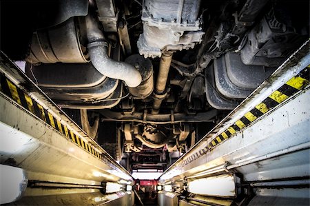 engine trouble - underneath of a truck as seen from vehicle inspection trench Stock Photo - Budget Royalty-Free & Subscription, Code: 400-06457116