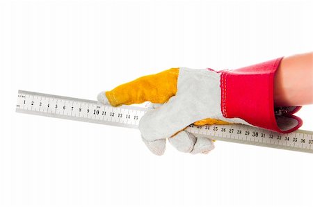 simsearch:400-05294430,k - gloved hand with a ruler isolated on a white background Stock Photo - Budget Royalty-Free & Subscription, Code: 400-06457204
