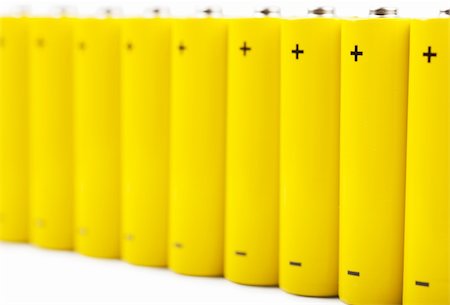 simsearch:400-06109171,k - A row of yellow batteries isolated over white background Stock Photo - Budget Royalty-Free & Subscription, Code: 400-06457549
