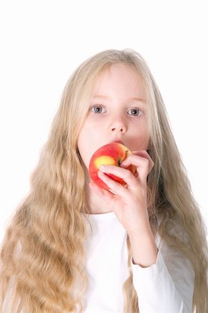 simsearch:400-05014700,k - young blond girl biting in red and yellow apple against white background Fotografie stock - Microstock e Abbonamento, Codice: 400-06457941