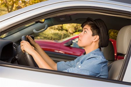 drivers licence - Very Stressed Mixed Race Woman Driving in Car and Traffic. Stock Photo - Budget Royalty-Free & Subscription, Code: 400-06457959