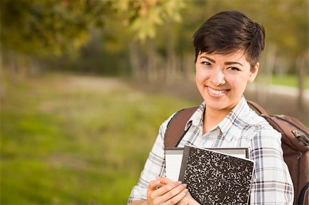 Outdoor Portrait of a Pretty Mixed Race Female Student Holding Books on a Sunny Afternoon. Stock Photo - Budget Royalty-Free & Subscription, Code: 400-06457971