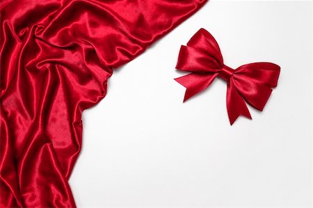 Shiny red satin ribbon on white background Stock Photo - Budget Royalty-Free & Subscription, Code: 400-06458550
