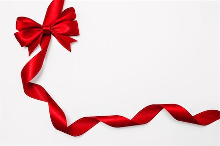 Shiny red satin ribbon on white background Stock Photo - Budget Royalty-Free & Subscription, Code: 400-06458586