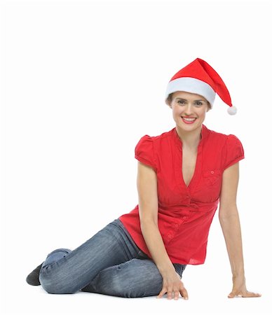 santa christmas hat women - Smiling young woman in Santa hat sitting on floor Stock Photo - Budget Royalty-Free & Subscription, Code: 400-06458884