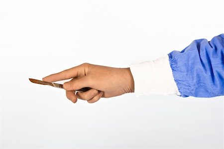 Surgeon holding scalpel in hand ready to operate Foto de stock - Royalty-Free Super Valor e Assinatura, Número: 400-06458951