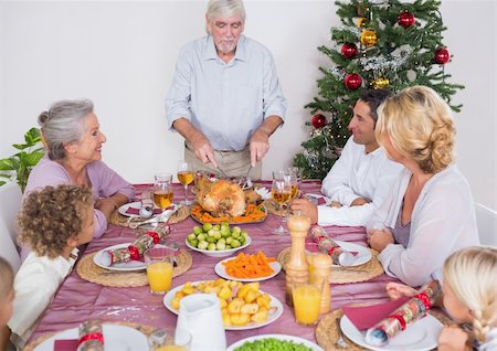 simsearch:400-06871557,k - Grandfather carving the turkey for christmas dinner Photographie de stock - Aubaine LD & Abonnement, Code: 400-06459301