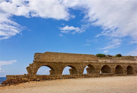 port land - Ancient Roman aqueduct at Ceasarea along the coast of the Mediterranean Sea, Israel. Stock Photo - Budget Royalty-Free & Subscription, Code: 400-06459638