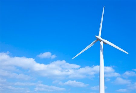 simsearch:400-07111713,k - Wind turbine set against a blue sky Stockbilder - Microstock & Abonnement, Bildnummer: 400-06459992