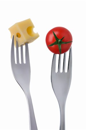 emmentaler cheese - cherry tomato and emmental cheese on forks against a white background Stock Photo - Budget Royalty-Free & Subscription, Code: 400-06464667