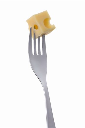 emmentaler cheese - emmental cheese cube on a fork against white background Stock Photo - Budget Royalty-Free & Subscription, Code: 400-06464669
