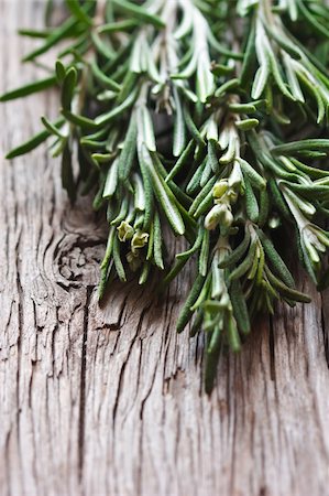Bunch of fresh rosemary on a wooden background, Stock Photo - Budget Royalty-Free & Subscription, Code: 400-06464709