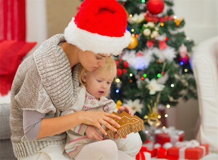 surprised toddler girl - Young mom and baby girl playing near Christmas tree Stock Photo - Budget Royalty-Free & Subscription, Code: 400-06464768