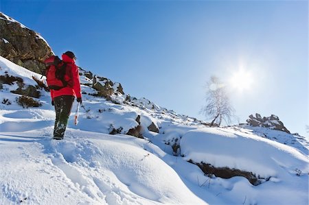 rcaucino (artist) - Winter hiking: male trekker walks along a snowy mountain path. Photographie de stock - Aubaine LD & Abonnement, Code: 400-06464918