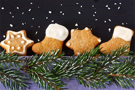 Christmas gingerbread cookies and spruce branch with snow. Stock Photo - Budget Royalty-Free & Subscription, Code: 400-06460132