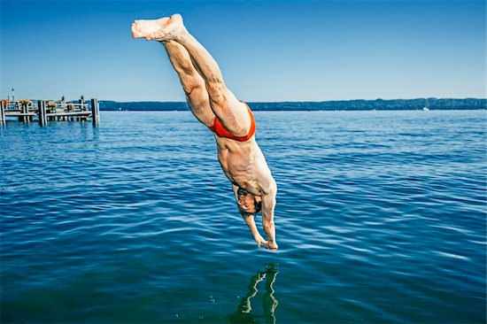 An image of a man jumping into the water Stock Photo - Royalty-Free, Artist: magann, Image code: 400-06460642