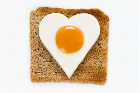 heart shaped cooked egg on a slice of toast Stock Photo - Budget Royalty-Free & Subscription, Code: 400-06461655