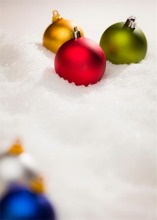 red christmas bulbs - Beautiful Various Colored Christmas Ornaments on Snow Flakes Room For Your Own Text. Stock Photo - Budget Royalty-Free & Subscription, Code: 400-06461838