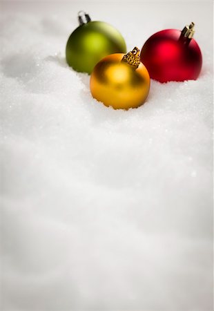red christmas bulbs - Beautiful Various Colored Christmas Ornaments on Snow Flakes Room For Your Own Text. Stock Photo - Budget Royalty-Free & Subscription, Code: 400-06461839