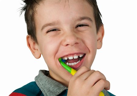 Boy brushing his teeth. White isolated Stock Photo - Budget Royalty-Free & Subscription, Code: 400-06462334