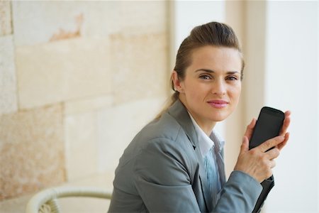 simsearch:400-06642775,k - Portrait of business woman with mobile phone Photographie de stock - Aubaine LD & Abonnement, Code: 400-06462565