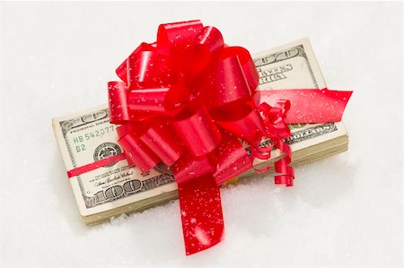 franklin - Stack of One Hundred Dollar Bills with Red Ribbon on Snow Flakes. Stock Photo - Budget Royalty-Free & Subscription, Code: 400-06462614