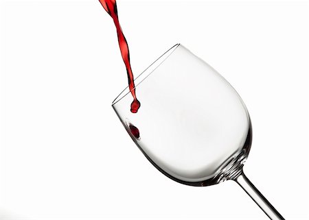 Burgandy red wine poured into a crystal wine glass against a white background Foto de stock - Royalty-Free Super Valor e Assinatura, Número: 400-06463029