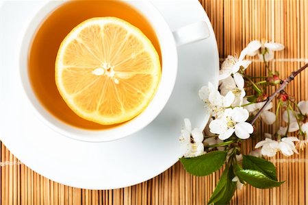 simsearch:400-05744742,k - Tea in white cup with lemon and cherry flower Stock Photo - Budget Royalty-Free & Subscription, Code: 400-06463120