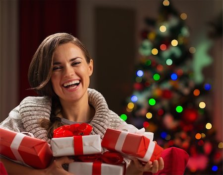 portrait picture adam and eve - Happy young woman holding Christmas present boxes Stock Photo - Budget Royalty-Free & Subscription, Code: 400-06463566