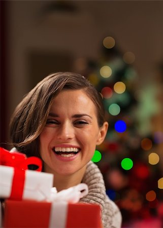 portrait picture adam and eve - Happy young woman looking out from Christmas gift boxes Stock Photo - Budget Royalty-Free & Subscription, Code: 400-06463569