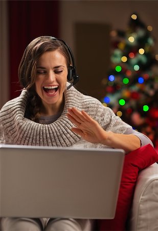 simsearch:400-06419734,k - Happy young woman having video chat with family in front of Christmas tree Stock Photo - Budget Royalty-Free & Subscription, Code: 400-06463587