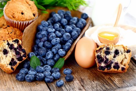 simsearch:400-06698338,k - Muffins with blueberry, egg and flour on wooden table Stock Photo - Budget Royalty-Free & Subscription, Code: 400-06476937