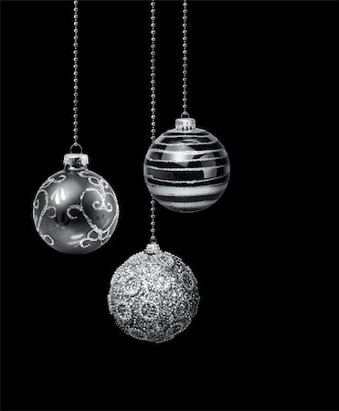 Three silver decoration Christmas balls hanging black background isolated Stock Photo - Budget Royalty-Free & Subscription, Code: 400-06477486