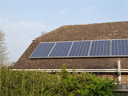 Domestic solar panels on house roof, a source of alternative energy and income from surplus electricity. Stock Photo - Budget Royalty-Free & Subscription, Code: 400-06477513