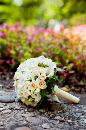 flowers on white stone - shot of wedding bouquet of roses laying on the ground Stock Photo - Budget Royalty-Free & Subscription, Code: 400-06477774