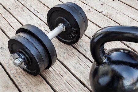 simsearch:400-07620929,k - exercise weights - kettlebell and dumbbells on a wooden deck - a home gym concept Stock Photo - Budget Royalty-Free & Subscription, Code: 400-06477920