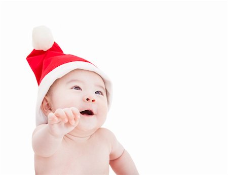 happy asian baby with christmas hat Foto de stock - Super Valor sin royalties y Suscripción, Código: 400-06478101