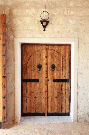 front door knob - View of the old front door Sfaks  in Tunisia Stock Photo - Budget Royalty-Free & Subscription, Code: 400-06478191