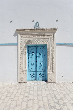 front door knob - Blue door and wall in Sfaks , Tunisia. Stock Photo - Budget Royalty-Free & Subscription, Code: 400-06478193