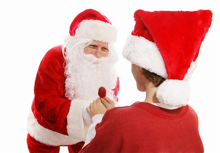 simsearch:400-05008640,k - Santa Claus giving a lollipop to a young boy.  White background. Photographie de stock - Aubaine LD & Abonnement, Code: 400-06478867