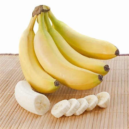 bunch of bananas  and slices on a wooden set Stock Photo - Budget Royalty-Free & Subscription, Code: 400-06478927