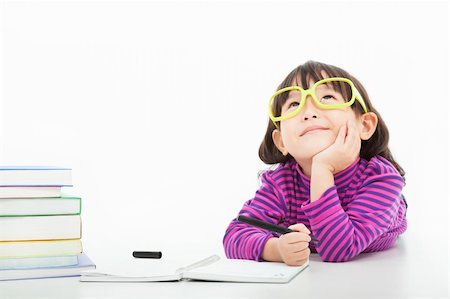 little girl  thinking or dreaming during preparing homework Photographie de stock - Aubaine LD & Abonnement, Code: 400-06479214